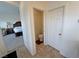 A neutral half-bathroom and a glimpse into the bedroom at 4780 Lorenzo Way, Pahrump, NV 89061