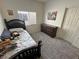 Comfortable bedroom with carpet, a dark wood bed, and closet space at 4780 Lorenzo Way, Pahrump, NV 89061