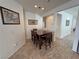 Bright breakfast nook featuring a wooden table and chairs, complemented by neutral walls and tile flooring at 4780 Lorenzo Way, Pahrump, NV 89061