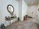 Welcoming foyer with tile flooring, a decorative console table, and a view of the front door at 4780 Lorenzo Way, Pahrump, NV 89061