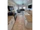 View from the kitchen into the living room features open concept design at 4780 Lorenzo Way, Pahrump, NV 89061