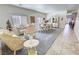 Spacious living room with an ornate dining set, elegant furnishings, and neutral decor at 4780 Lorenzo Way, Pahrump, NV 89061
