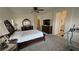 View of spacious main bedroom with large dressers and a television at 4780 Lorenzo Way, Pahrump, NV 89061