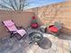 Cozy outdoor patio offers a fire pit and seating, perfect for enjoying warm desert evenings at 4780 Lorenzo Way, Pahrump, NV 89061