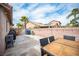 Spacious backyard with a well-kept stamped concrete patio and a charming garden area, perfect for outdoor enjoyment at 5014 Sail Rock Pl, North Las Vegas, NV 89031