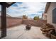 Wide backyard featuring stamped concrete, string lights and defined perimeter, perfect for entertaining and relaxing outdoors at 5014 Sail Rock Pl, North Las Vegas, NV 89031