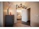 Hallway view of a bathroom entrance, featuring a decorative vanity with double sinks at 5014 Sail Rock Pl, North Las Vegas, NV 89031