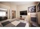Inviting bedroom with a large bed, TV, and Star Wars-themed decor for entertainment at 5014 Sail Rock Pl, North Las Vegas, NV 89031