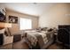 Comfortable bedroom with a cozy bed, a window, and neutral decor at 5014 Sail Rock Pl, North Las Vegas, NV 89031