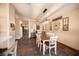 Bright dining area with stylish table and farmhouse decor, open to the kitchen at 5014 Sail Rock Pl, North Las Vegas, NV 89031