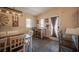 Dining room featuring farmhouse table, rustic decor, and lots of natural light at 5014 Sail Rock Pl, North Las Vegas, NV 89031