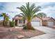 Attractive single-story home with desert landscaping and a convenient two-car garage at 5014 Sail Rock Pl, North Las Vegas, NV 89031