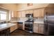 Modern kitchen featuring stainless steel appliances, countertops, and a functional layout at 5014 Sail Rock Pl, North Las Vegas, NV 89031