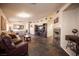 Spacious living room featuring tile flooring and a cozy fireplace at 5014 Sail Rock Pl, North Las Vegas, NV 89031