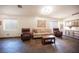 Inviting living room with tile flooring, plush seating, and ample natural light at 5014 Sail Rock Pl, North Las Vegas, NV 89031