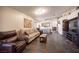 Comfortable living room with tile floors, neutral walls, and lots of natural light at 5014 Sail Rock Pl, North Las Vegas, NV 89031