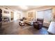 Open living room with a fireplace, tile floors and large windows for natural light at 5014 Sail Rock Pl, North Las Vegas, NV 89031