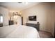 Comfortable main bedroom with a TV and dresser for entertainment and storage solutions at 5014 Sail Rock Pl, North Las Vegas, NV 89031