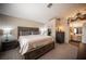 Spacious main bedroom featuring a neutral color scheme, king bed, and elegant decor at 5014 Sail Rock Pl, North Las Vegas, NV 89031