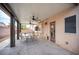 Enjoyable covered patio offering ceiling fans, comfortable seating, and a serene backyard view for relaxing outdoors at 5014 Sail Rock Pl, North Las Vegas, NV 89031