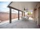 Relaxing covered patio with ceiling fans and stylish seating, creating an ideal outdoor living space at 5014 Sail Rock Pl, North Las Vegas, NV 89031