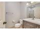 Bathroom features gray vanity with white sink, white toilet, and tiled floors at 508 Indian Princess Dr # 104, Las Vegas, NV 89145