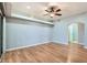 Spacious bedroom with wood floors, ceiling fan and access to a walk-in closet at 508 Indian Princess Dr # 104, Las Vegas, NV 89145