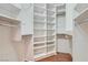 Organized walk-in closet with shelving and clothing rods at 508 Indian Princess Dr # 104, Las Vegas, NV 89145