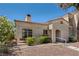 Single story home with stucco exterior, terracotta roof and gravel landscaping at 508 Indian Princess Dr # 104, Las Vegas, NV 89145