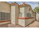 Close-up exterior view shows the textured stucco, accent trim, and window details of the home at 508 Indian Princess Dr # 104, Las Vegas, NV 89145