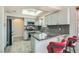 Charming kitchen features gray cabinets, granite counters, and a skylight for natural light at 508 Indian Princess Dr # 104, Las Vegas, NV 89145