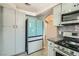 Bright kitchen boasts modern stainless steel appliances and gray cabinets, backsplash and flooring at 508 Indian Princess Dr # 104, Las Vegas, NV 89145