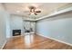 Spacious living room with fireplace, hardwood floors, and a sliding glass door to outdoor space at 508 Indian Princess Dr # 104, Las Vegas, NV 89145