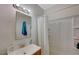 Well-lit bathroom with a sink, mirror, and shower at 5228 Pebble Beach Blvd, Las Vegas, NV 89108
