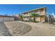 Inviting two-story apartment complex with mature landscaping, palm trees, and ample parking at 5228 Pebble Beach Blvd, Las Vegas, NV 89108
