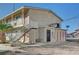 Two-story apartment complex with exterior access stairs and individual unit doors at 5228 Pebble Beach Blvd, Las Vegas, NV 89108