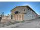 Back side view of apartment complex with multiple entry doors and staircase at 5228 Pebble Beach Blvd, Las Vegas, NV 89108