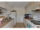This kitchen has white cabinets and a gas range at 5228 Pebble Beach Blvd, Las Vegas, NV 89108