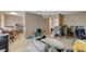 Open-concept living area with wood floors, plenty of light, and dining area at 5228 Pebble Beach Blvd, Las Vegas, NV 89108