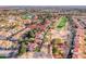 Aerial view showcasing the home's location near a golf course and lush green spaces in a desirable community at 5501 Painted Sunrise Dr, Las Vegas, NV 89149