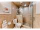 Bathroom featuring tiled walls and glass enclosed shower at 5501 Painted Sunrise Dr, Las Vegas, NV 89149