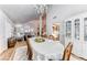 Open dining room featuring high ceilings, hardwood floors, and view to the living room at 5501 Painted Sunrise Dr, Las Vegas, NV 89149