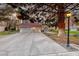 Charming home with a well-manicured lawn and a spacious three-car garage, all illuminated by soft exterior lighting at 5501 Painted Sunrise Dr, Las Vegas, NV 89149