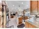 Spacious kitchen with a central island, wooden cabinets, and stainless steel refrigerator at 5501 Painted Sunrise Dr, Las Vegas, NV 89149