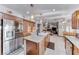 Open-concept kitchen featuring an island with cooktop and view to the living area at 5501 Painted Sunrise Dr, Las Vegas, NV 89149