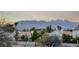 Scenic view of rooftops with desert landscaping and a mountain backdrop at 5501 Painted Sunrise Dr, Las Vegas, NV 89149
