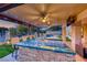 Gourmet outdoor kitchen with a spacious bar, built-in grill, and ample counter space, perfect for summer barbecues at 5501 Painted Sunrise Dr, Las Vegas, NV 89149