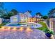 Stunning backyard with a pool and spa, surrounded by lush landscaping and a patio, creating a private oasis at 5501 Painted Sunrise Dr, Las Vegas, NV 89149