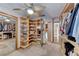 Large walk-in closet featuring custom shelving, mirror doors, and ample storage space at 5501 Painted Sunrise Dr, Las Vegas, NV 89149
