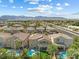 Aerial view of a desert home with a backyard pool and mountain views at 5578 Holcomb Bridge Ct, Las Vegas, NV 89149